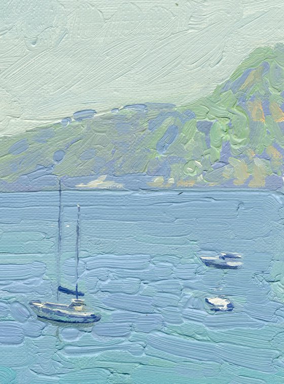 Yachts and umbrellas on the beach