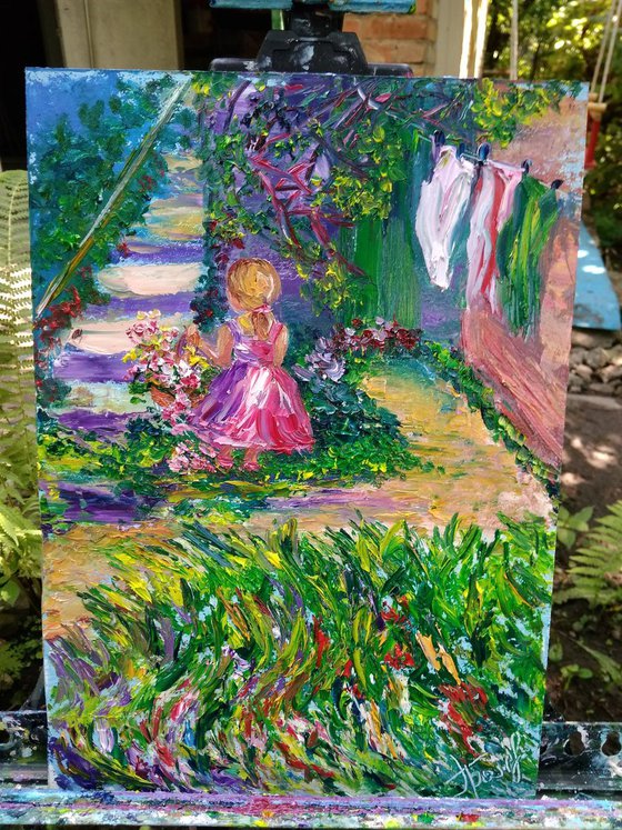 Girl picking flowers in the garden