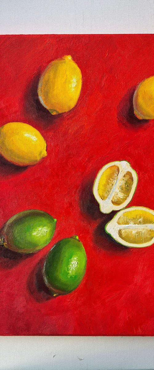 Lemon on red background by Leyla Demir