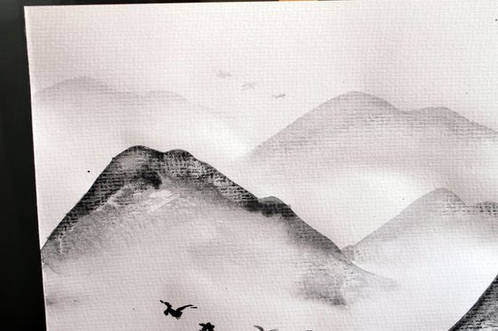 Mountains and flying birds