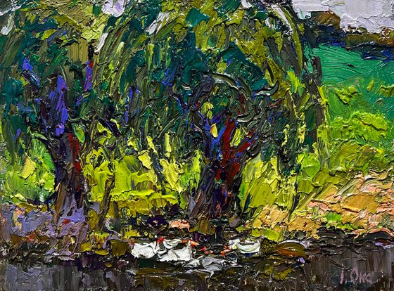 The ducks hid near the tree