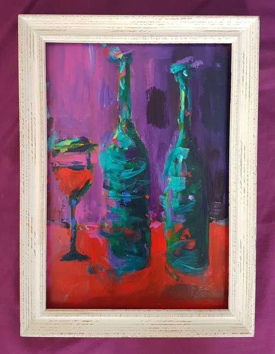 Bottles and a Glass on a Red Table