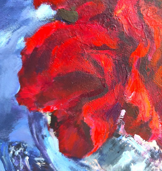 Red roses in a metal vase