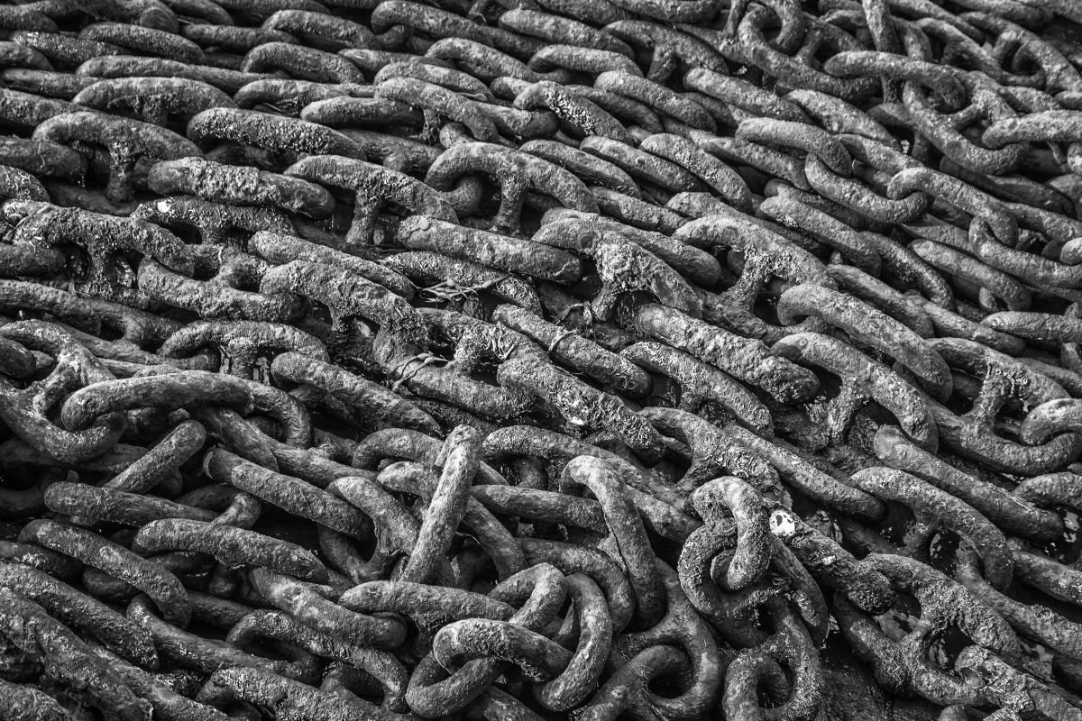 Black and white rusty old chains by Paul Nash