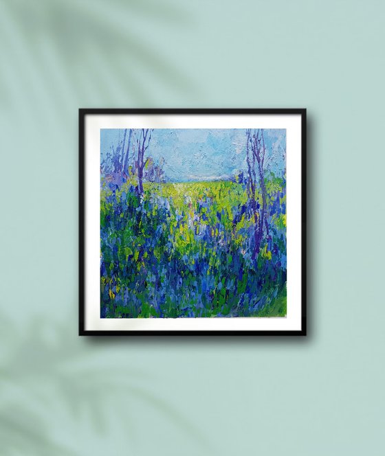 Meadow with blue flowers.