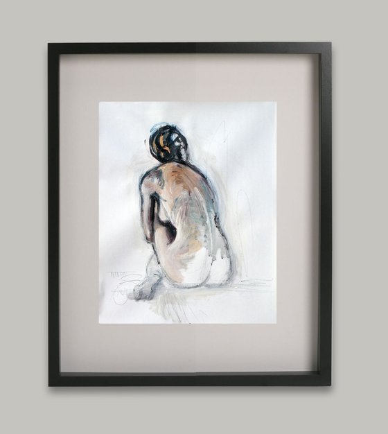 nude woman sitting on the floor