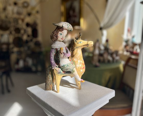 Vintage dressed girl with ice riding horse.