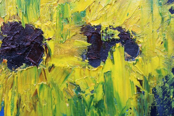 Sunflowers in blue vase