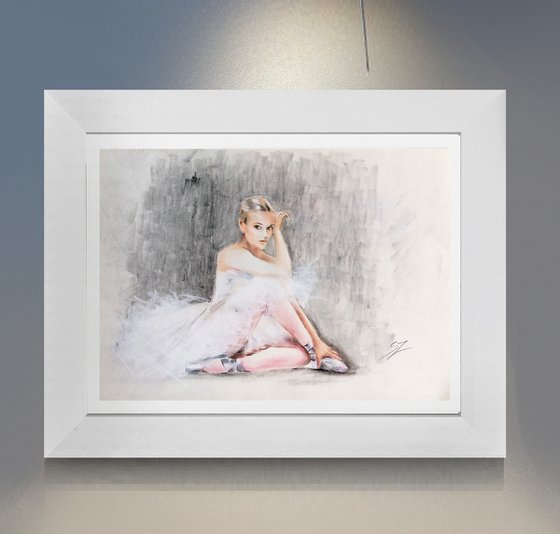Seated ballerina with a white dress