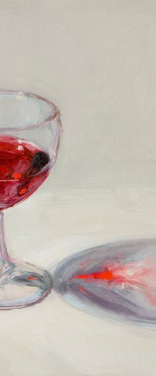 glass of red wine on white by Olivier Payeur
