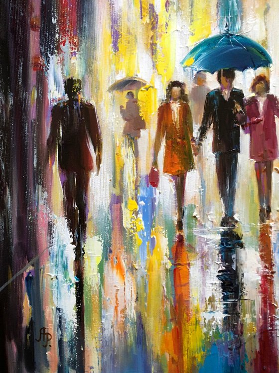 With an umbrella in the rain