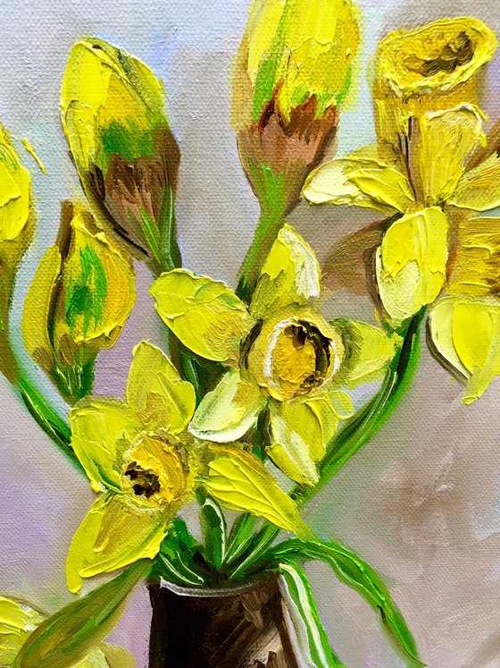 Bouquet of Daffodils on red table, still life inspired by spring.
