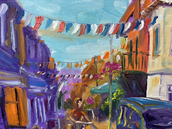Festive Dutch town scene with cyclist