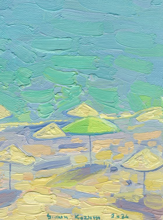 Yachts and umbrellas on the beach