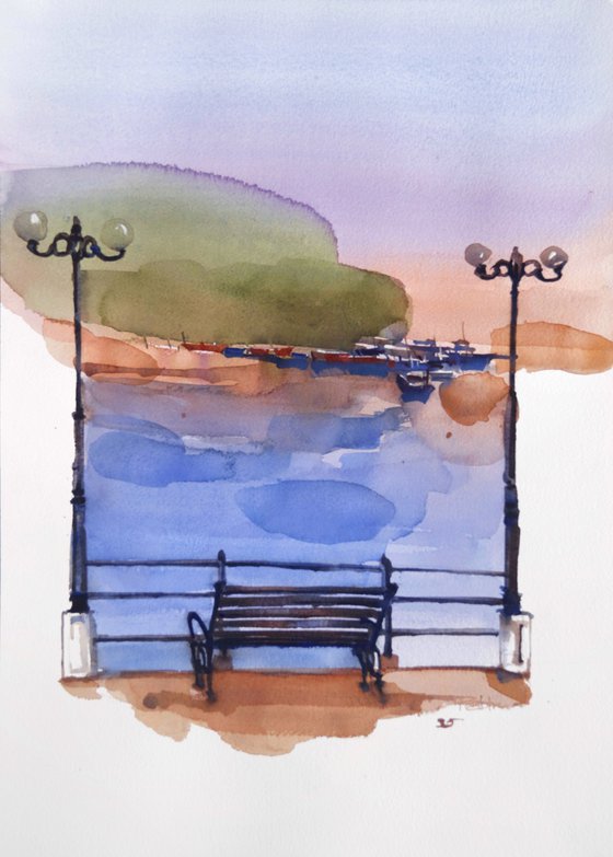 River flows, bench watches