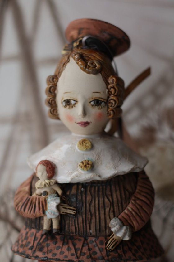 Vintage girl with a doll. From "Le Carousel, Hommage à l'Innocence" project by Elya Yalonetski