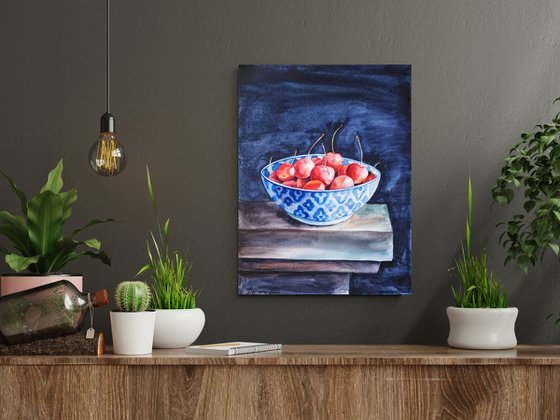 Cherries in patterned bowl