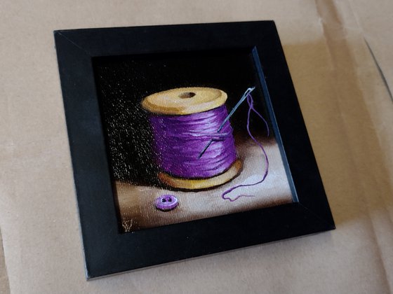 Little Purple  cotton reel  still life