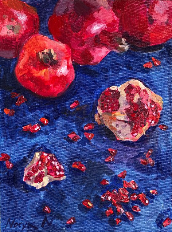 Pomegranates on blue