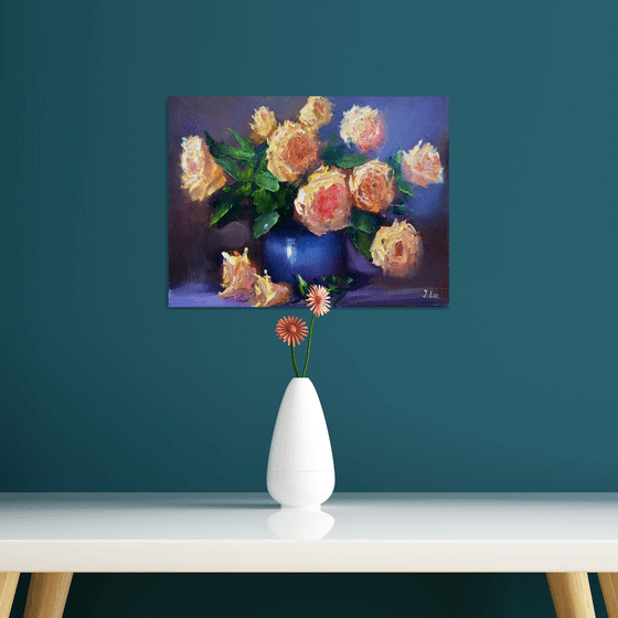 Yellow roses in a blue vase