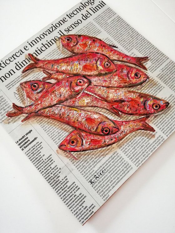 Red Fishes on Newspaper
