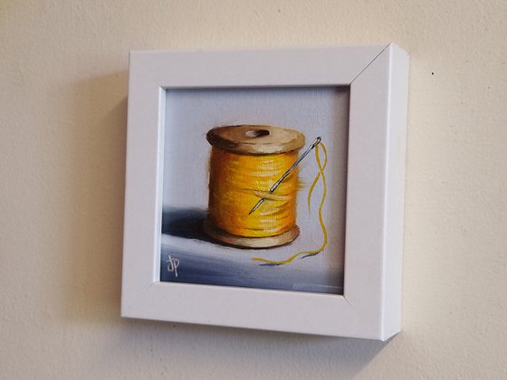 Little yellow cotton reel still life