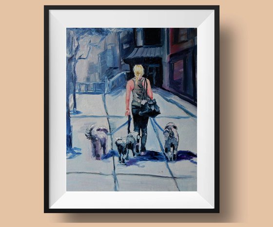 Woman walking with the dogs. Cityscape.