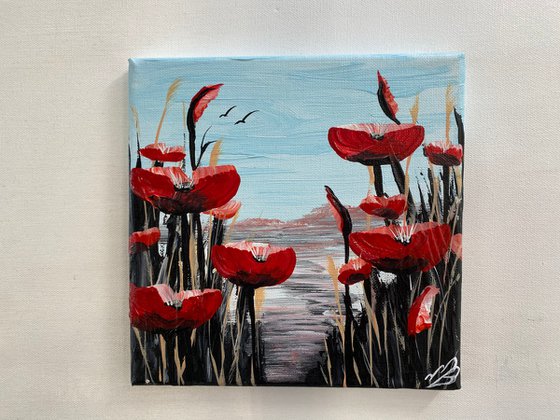 Abstract poppies against a blue sky