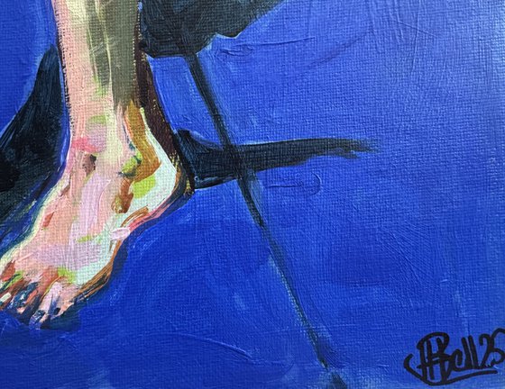 Young nude man in blue room