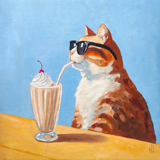 Cat drinking a milkshake