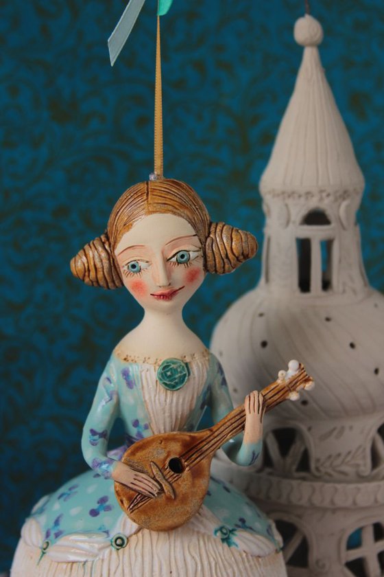 Girl with a mandoli. Ceramic hanging sculpture