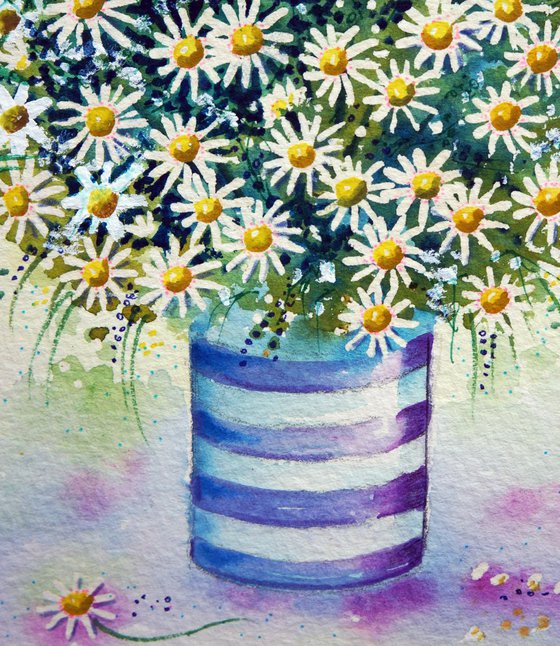 Daisies in a striped pot