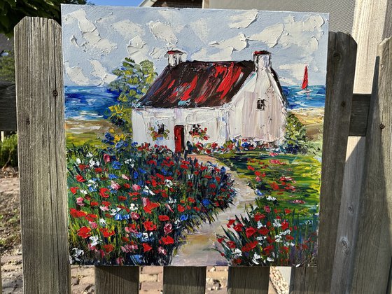 Old house with red flowers