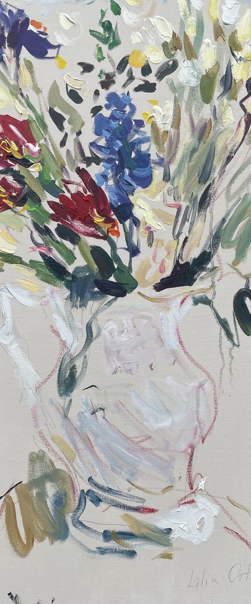 Spring flowers in a white jug. by Lilia Orlova-Holmes