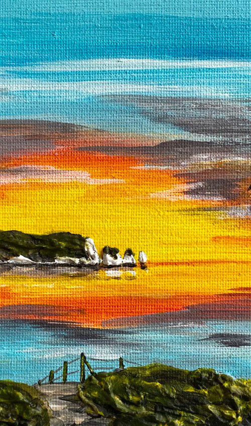 Sunrise over The Needles on the Isle of Wight by Marja Brown