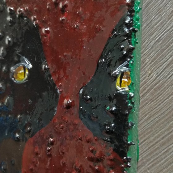 "Cat looking in to the mirror"