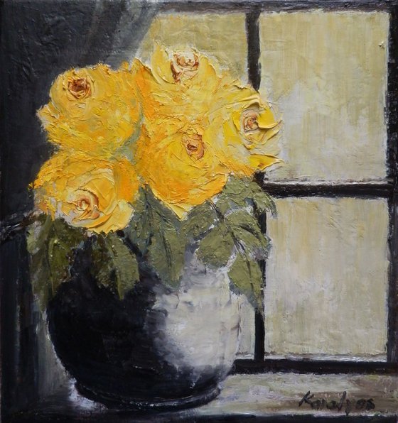 Yellow roses in a window