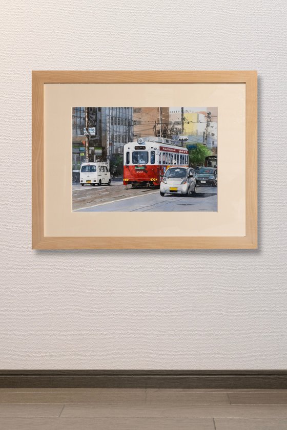 Red and White Tram in the City