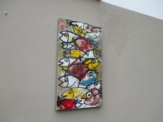 coloured fishes jumping
