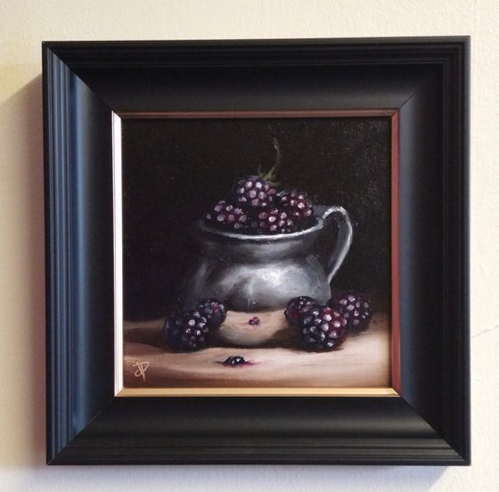 Silver cup with blackberries still life