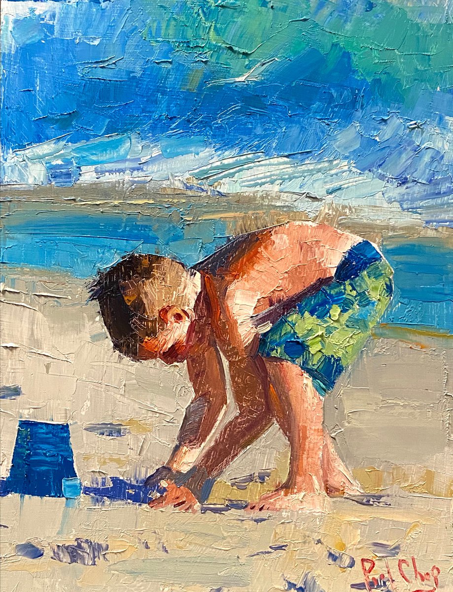 Boy Playing Sand in Beach by Paul Cheng