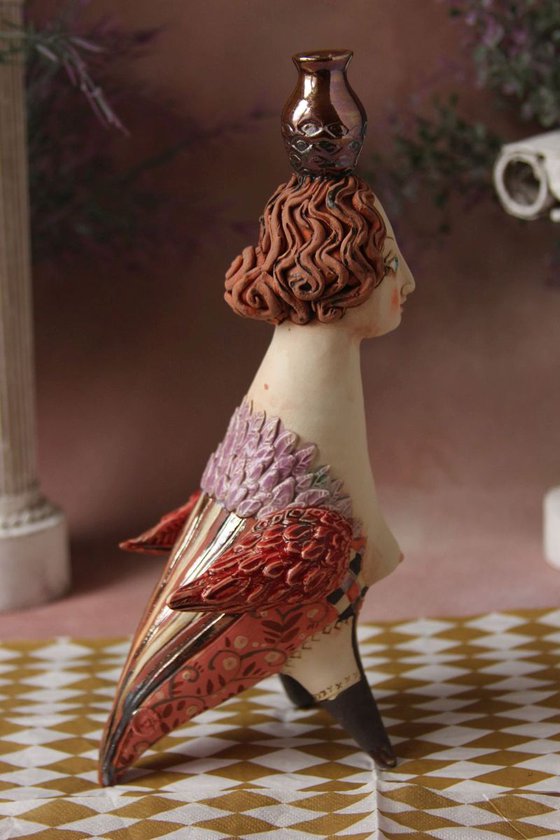 Bird Women with a jug. Ceramic sculpture