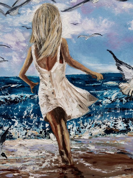 Girl chasing a seagulls