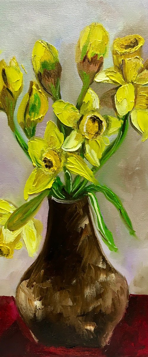 Bouquet of Daffodils on red table, still life inspired by spring. by Olga Koval