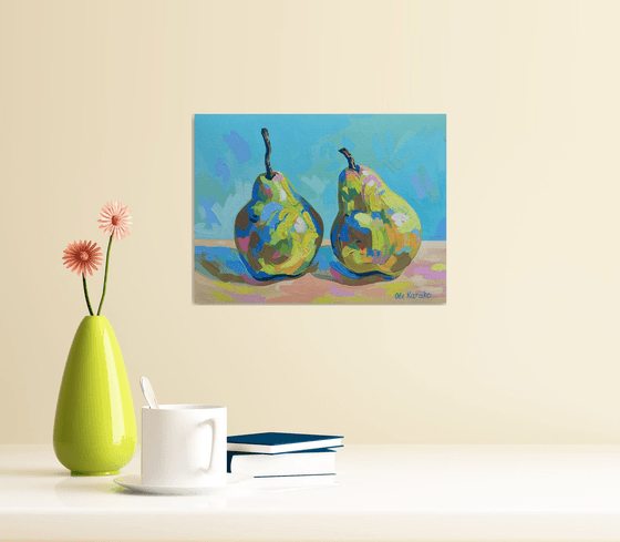 Two pears on a blue background