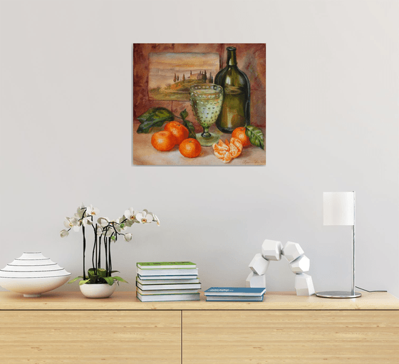 Still life with a green bottle and tangerines