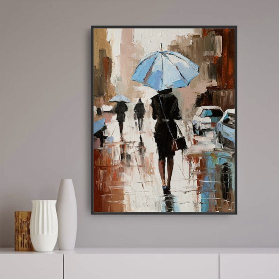 Woman with umbrella in a rainy city.