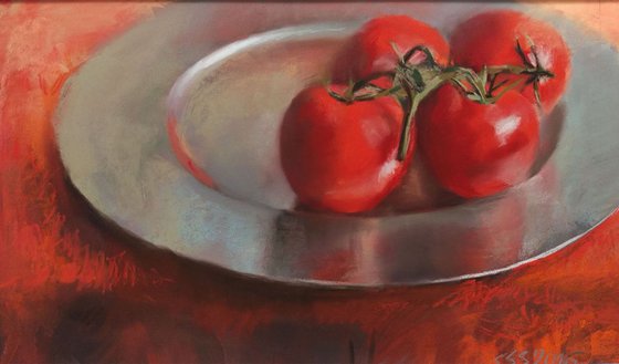 Tomatoes on silver plate