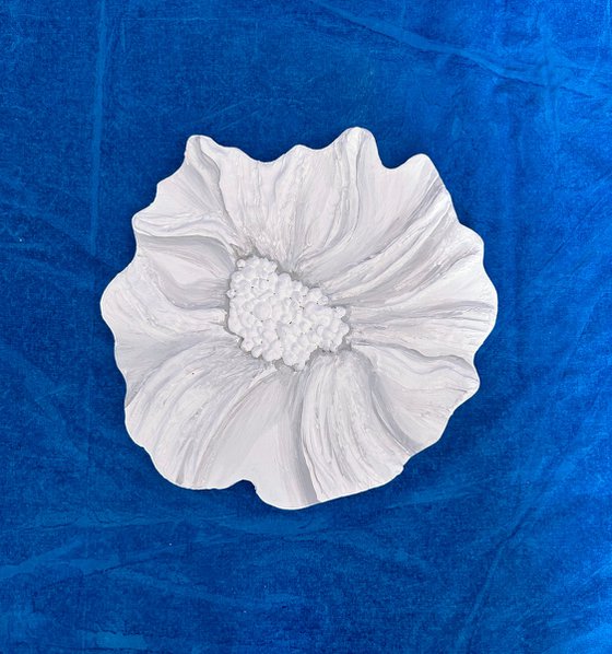 Small white sculptured  flower