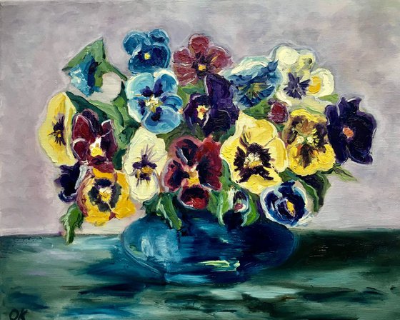 Flowers in a blue vase. Pansy in a vase . Bouquet of wild flowers. On sale.